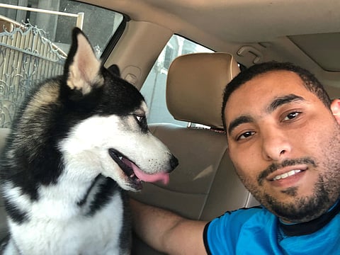 Kareem Majdi Abdul Majid with his dog Mickey