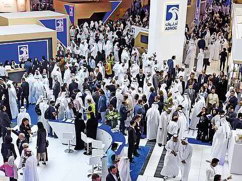 Delegates and visitors tour the Adnoc pavilion during the last day of Adipec on Thursday.