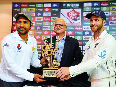 Pakistani skipper Sarfraz Ahmad (left) and his New Zealand counterpart Kane Williamson pose with the trophy for the upcoming Test series at the Zayed International Stadium.