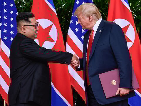 North Korean leader Kim Jong Un, left, and U.S. President Donald Trump shake hands at the conclusion of their meetings at the Capella resort on Sentosa Island in Singapore in June 2018.