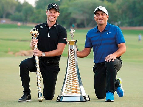 Danny Willett and Francesco Molinari with their trophies at the Jumeirah Golf Estates in Dubai on Sunday.