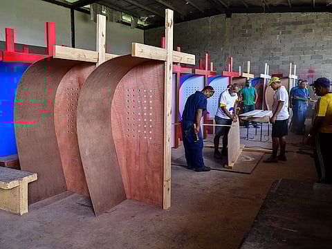 Inmates at La Joya prison work in the production of 250 confessionals for the upcoming World Youth Day Panama, on November 13, 2018 in Panama City