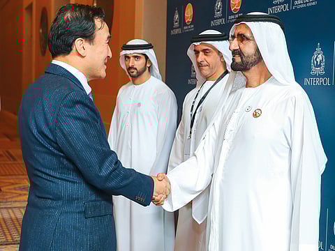 Shaikh Mohammad meets Kim Jong-yang, Interpol’s senior vicepresident, as Shaikh Hamdan and Shaikh Saif look on in Dubai on Sunday.