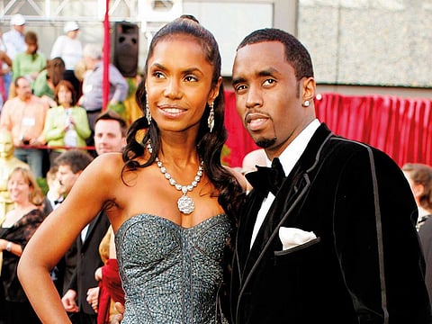 Sean "P. Diddy" Combs arrives with Kim Porter