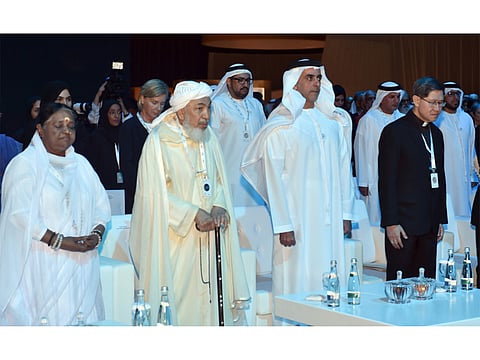 From left: Mata Amrithanandamayi, Shaikh Abdallah Bin Bayyah, Shaikh Saif Bin Zayed Al Nahyan and Luis Antonio, Arch bishop of Manila, observing a minute of silence before the start of the Ministry of Interior’s 'Interfaith Alliance for Safer Communities: Child Dignity Online' forum at the ADNEC.
