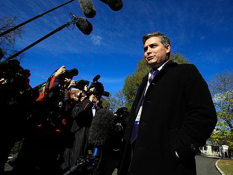 CNN's Jim Acosta speaks to journalists on the North Lawn upon returning back to the White House in Washington, Friday, Nov. 16, 2018.