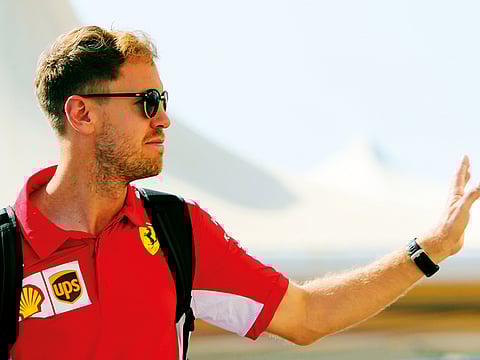 Sebastian Vettel of Germany arrives at the Yas Marina racetrack in Abu Dhabi, on Thursday.
