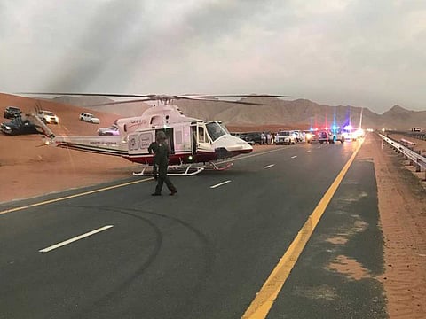 Police rescue man from burning car.