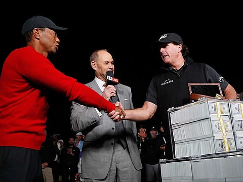 Tiger Woods (left) and Phil Mickelson have been great competitiors on the course and close friends off it.