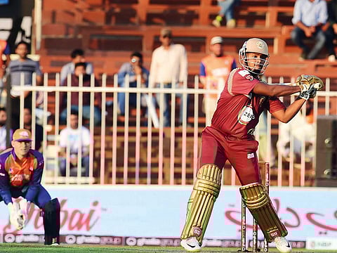Nicholas Pooran of Northern Warriors takes the aerial route against Bengal Tigers at the Sharjah Stadium.