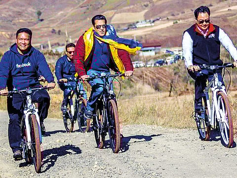 Salman Khan (centre), Indian Union minister of State for Home Affairs Kiren Rijiju (right), and Arunachal Pradesh Chief Minister Pema Khandu (left) riding mountain bikes in Mechuka, in Arunachal Pradesh.