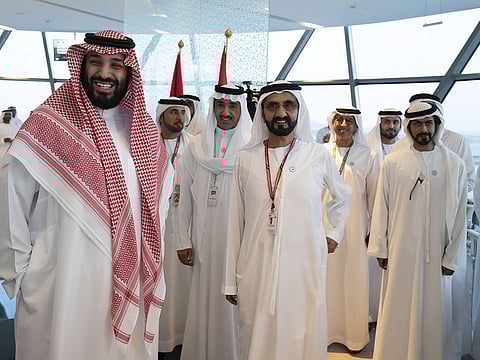 Shaikh Mohammad Bin Rashid, Mohammad Bin Salman, Shaikh Khalifa Bin Tahnoon (2nd L) and other dignitaries in Shams Tower.