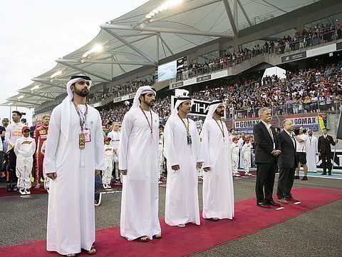 His Highness Shaikh Mohammad Bin Rashid Al Maktoum, Vice-President, Prime Minister of the UAE, Ruler of Dubai and Minister of Defence with Shaikh Hazza Bin Zayed Al Nahyan, Vice Chairman of the Abu Dhabi Executive Council; Jean Todt, President of the Federation International Automobile; Chase Carey, Chairman & CEO of the Formula One Group; Shaikh Hamdan Bin Mohammad Al Maktoum, Crown Prince of Dubai (fifth from right); and Shaikh Mansour Bin Mohammad Bin Rashid Al Maktoum at the final race of the 2018 Formula 1 Etihad Airways Abu Dhabi Grand Prix..
