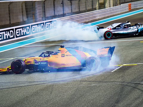 Lewis Hamilton and Fernando Alonso making Doughnuts after the Abu Dhabi Grand Prix.