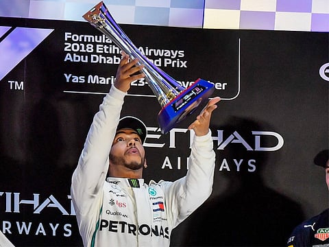 Lewis Hamilton celebrates after winning the Abu Dhabi Grand Prix at Yas Marina circuit.