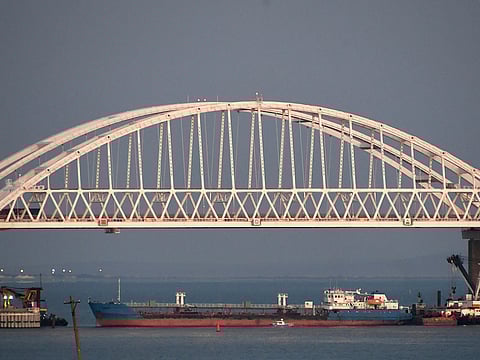 A ship under the the Kerch bridge blocks the passage to the Kerch Strait near Kerch, Crimea, Sunday, Nov. 25, 2018.