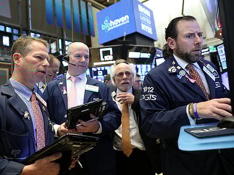 Traders work on the floor at the New York Stock Exchange (NYSE) on November 26, 2018.