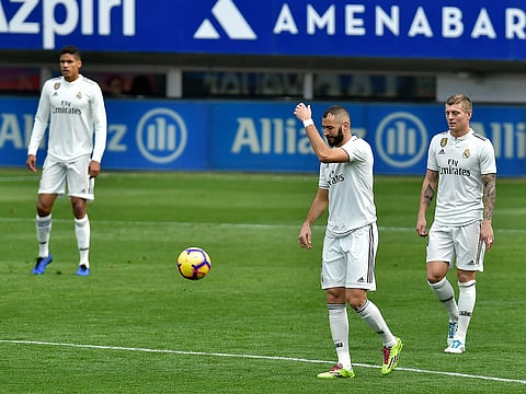 Real Madrid's Karim Benzema, second right, gestures after Deportivo SD Eibar scored their second goal during the Spanish La Liga soccer match between Real Madrid and SD Eibar at Ipurua stadium, in Eibar, northern Spain, Saturday, November 24, 2018.
