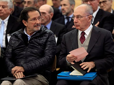 Former Bankia president Rodrigo Rato (R) and former Bankia board member Jose Antonio Moral Santin (L) attend the first hearing in the Bankia trial in San Fernando de Henares on November 26, 2018.