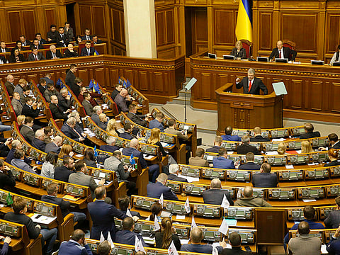 Ukrainian President Petro Poroshenko speaks during a parliament session to review his proposal to introduce martial law.