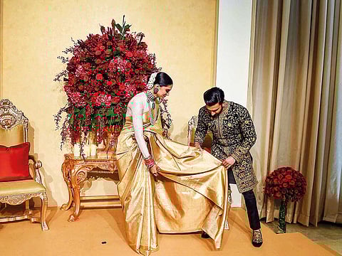 Actress Deepika Padukone is wearing a sari from Angadi Galleria in this image