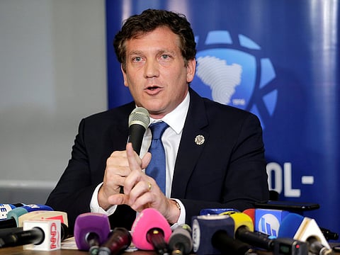 President of the CONMENBOL Alejandro Dominguez speaks to the media after having a meeting with Daniel Angelici and Rodolfo D'Onofrio, presidents of soccer clubs Boca Juniors and River Plate respectively at the CONMEBOL headquarters to discuss the rescheduling of Copa Libertadores final, which was postponed after a bus with players was attacked, in Luque, Paraguay November 27, 2018.