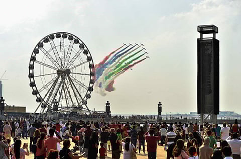 Thousands of people gather at the Dubai Festival City Mall to witness the colourful UAE National Day Celebrations on 2nd December, 2017. The flyby display from al Fursan, the UAE airforces' aerobatic display team thrill visitors with burst of the UAE National Flag colours in the sky