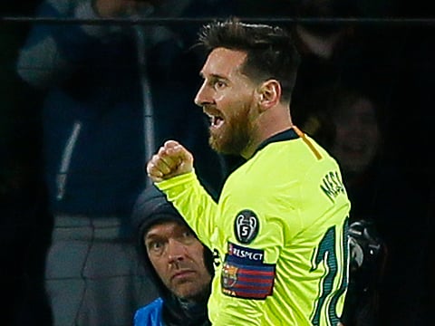 Barcelona forward Lionel Messi celebrates scoring his side's first goal.