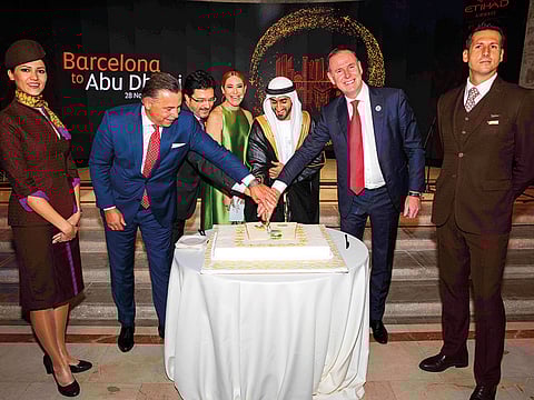 From left: Robin Kamark, Chief Commercial Officer, Etihad Aviation Group, Isidre Gavin Valls, Secretary for Infrastructure and Transport and President of the Barcelona Air Route Development Committee, MC Ainhoa Arbizu, Mohammad Al Shamsi, UAE Consul General in Barcelona and Tony Douglas, Group CEO, Etihad, cut the ceremonial cake.
