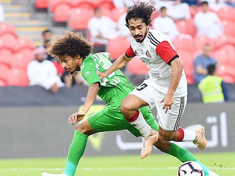 Al Jazira’s Khalfan Mubarak steams past Emirates’ Saad Surour in the Pride of Abu Dhabi’s 6-0 win over the Falcons.