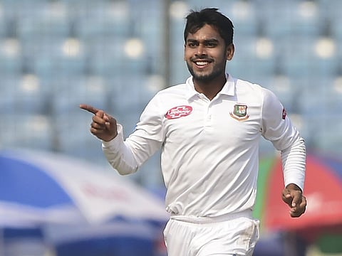 Bangladeshi cricketer Mehidy Hasan celebrates the dismissal of West Indies cricketer Kieran Powell.