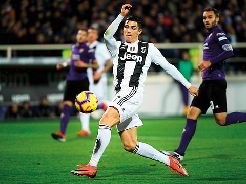 Juventus's striker Cristiano Ronaldo kicks the ball during the Italian Serie A football match against Fiorentina on December 1, 2018 at the Artemio Franchi Stadium in Florence.