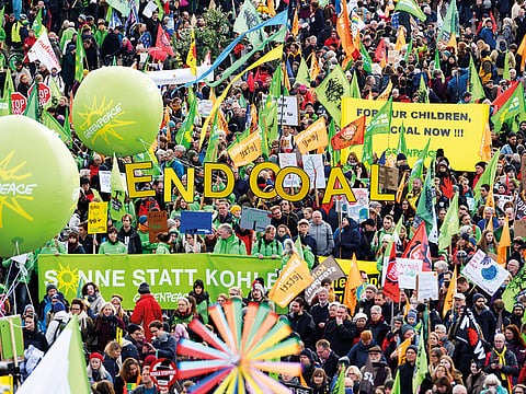 Demonstrators take part in a climate demonstration in Cologne, Germany,