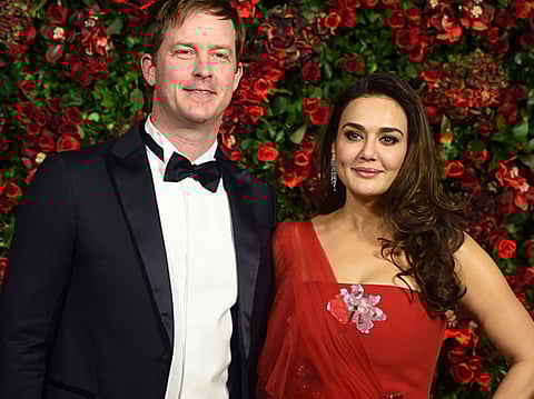 Indian Bollywood actress Preity Zinta (R) and Gene Goodenough.
