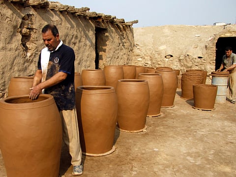Iraqis making clay pots in Najaf. Pottery has deep roots in Iraq, where ancient civilisations turned to clay to build their homes, shape their cooking utensils, and even make their ovens.