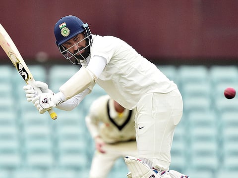 India's Cheteshwar Pujara plays a shot on the second day of the tour match against Cricket Australia XI at the SCG in Sydney on November 29, 2018.