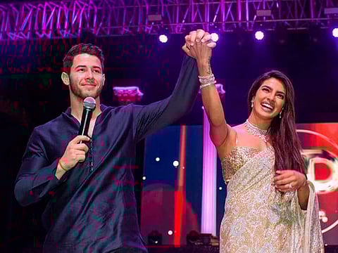 Bollywood actress Priyanka Chopra, right and Nick Jonas during a ceremony before their wedding, at Umaid Bhawan in Jodhpur.
