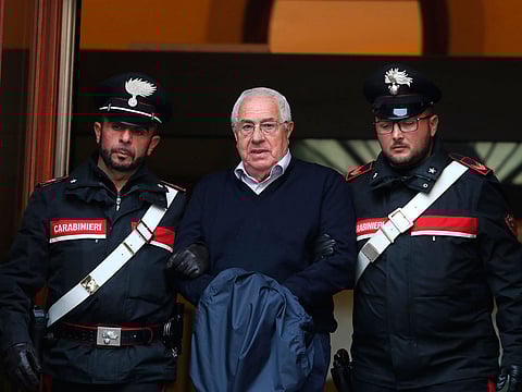 Settimo Mineo, center, who allegedly took over as the Palermo head of Cosa Nostra, is escorted by Italian Carabinieri police after an anti Mafia operation which led the arrest of 46 people including the presumed regional boss, in Palermo, Sicily, Italy.
