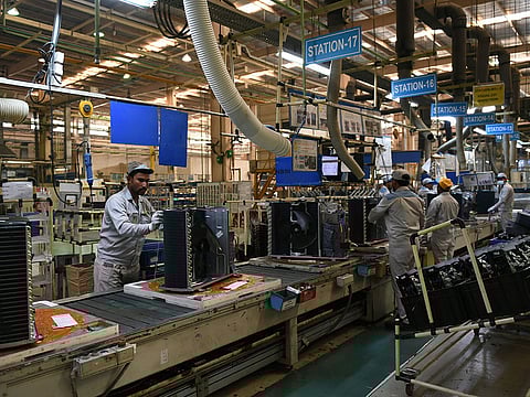 Indian workers on the production line in the Daikin air conditioning plant in Neemrana, about 120km southwest of the Indian capital New Delhi.