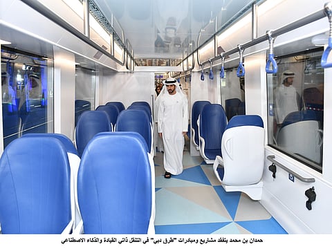 Hamdan Bin Mohammad inspects two models of Dubai Sky pods