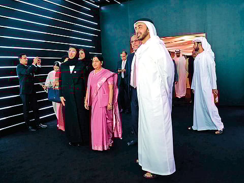 Shaikh Abdullah, Sushma Swaraj and Noora Al Kaabi take a tour of the Zayed-Gandhi digital museum.