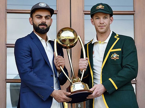 Virat Kohli (left) and Tim Paine pose with the Border Gavaskar trophy ahead of their previous Test series in 2018.