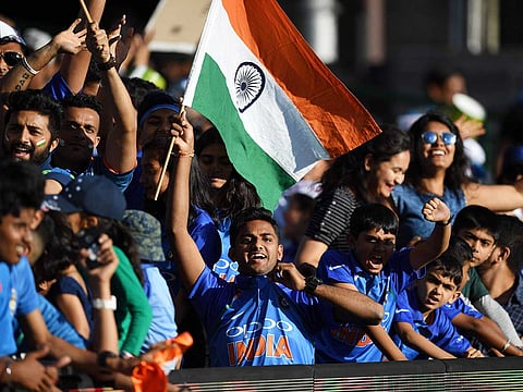 This November 25, 2018 photo shows Indian supporters jubilating during the Australia against India T20 international cricket match at Sydney Cricket Ground (SCG) in Sydney.