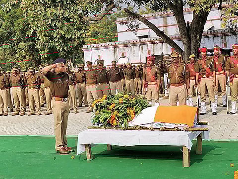 Police officials pay tribute to Police Inspector Subodh Kumar Singh, during a wreath-laying ceremony in Etah, Tuesday, Dec. 04, 2018. Singh was killed during violent clashes that erupted over the alleged illegal slaughter of cattle, in Bulandshahr yesterday.