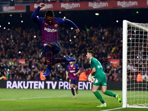 Barcelona's Malcom celebrates after scoring.