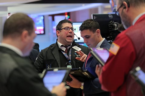 Traders work on the floor of the New York Stock Exchange. The US presidential election less than a month away, stress-levels among most market participants are expected to be tested in the weeks to come.
