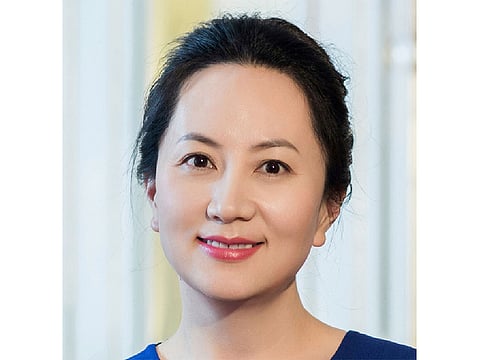 In this undated photo released by Huawei, Huawei's chief financial officer Meng Wanzhou is seen in a portrait photo. China on Thursday, Dec. 6, 2018, demanded Canada release the Huawei Technologies executive who was arrested in a case that adds to technology tensions with Washington and threatens to complicate trade talks.