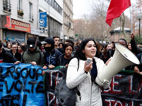 School children demonstrate in Paris, Friday Dec.7, 2018. Footage showing the brutal arrest of high school students protesting outside Paris is causing a stir ahead of further anti-government protests this weekend.