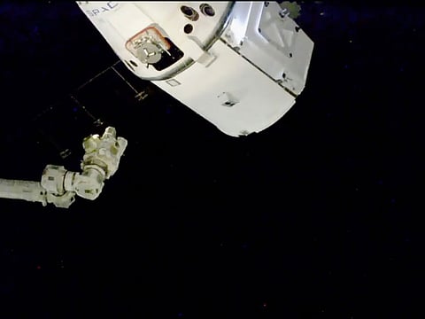The SpaceX Dragon cargo spacecraft approaches robotic arm for docking to the International Space Station, Saturday, Dec. 8, 2018.