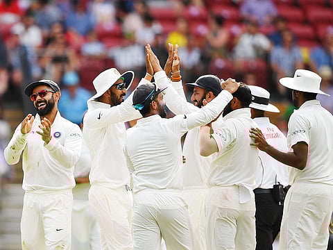 Indian team celebrates an Australian wicket on day four in Adelaide.